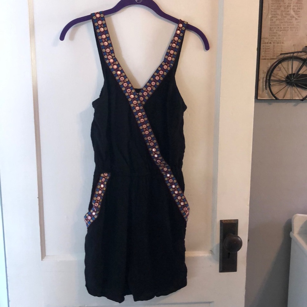 Black romper, with beautiful detail.